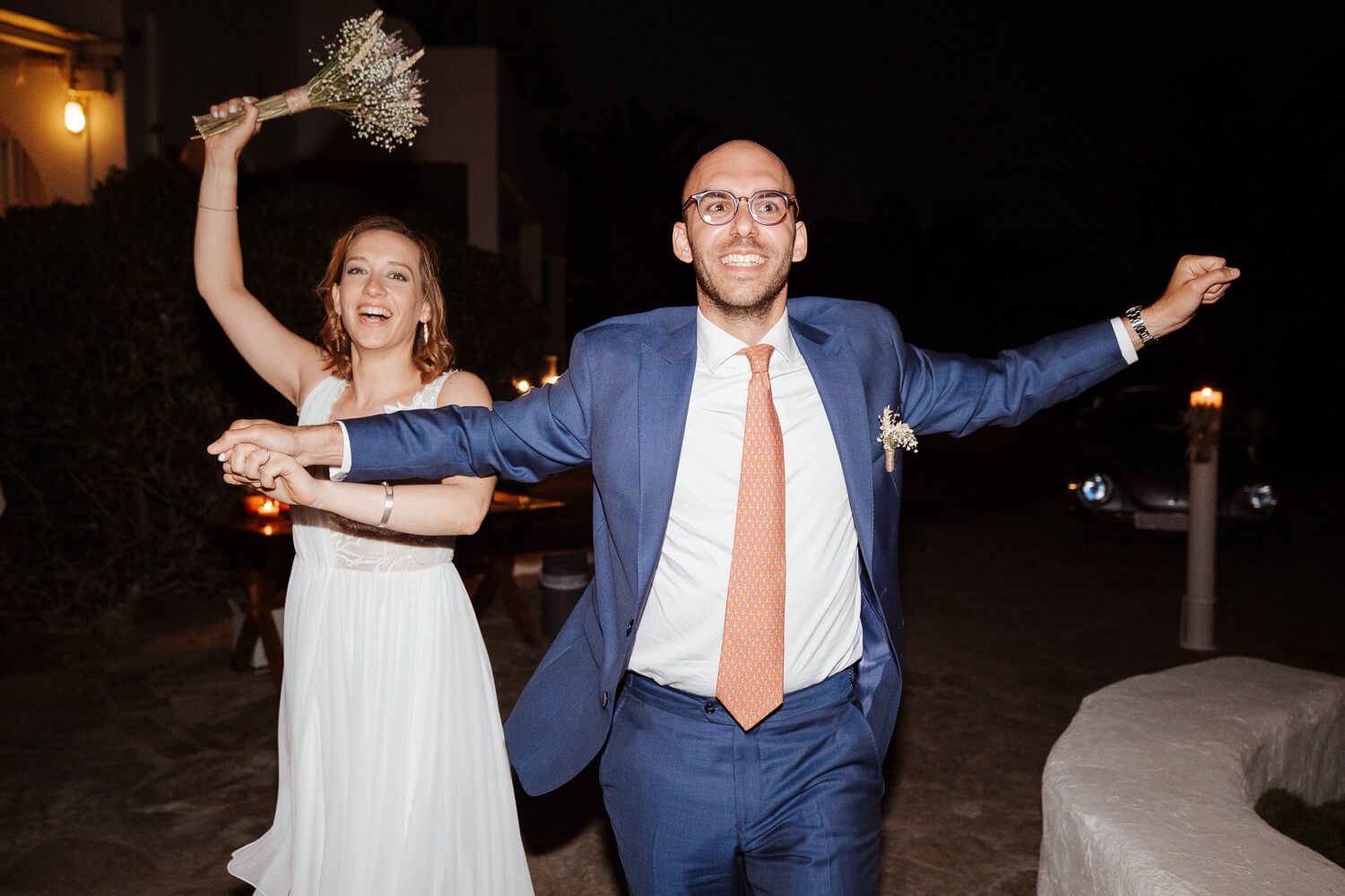 Dimitris and Ioanna walking into Rebel Bar hand in hand