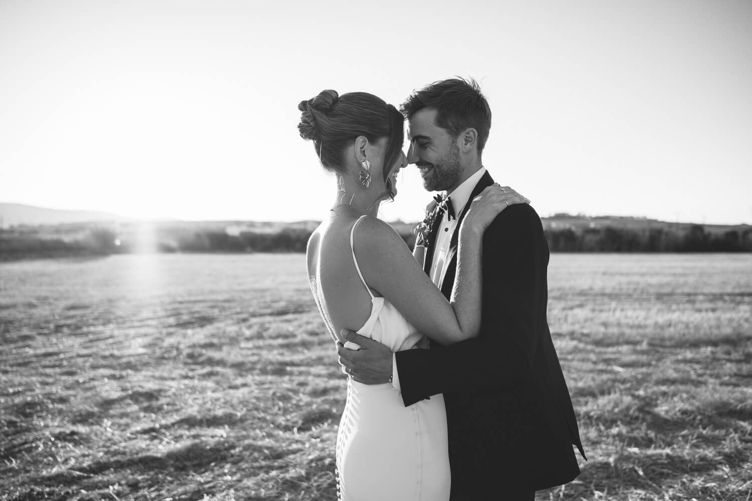 Golden hour light illuminating the happy newlyweds in Paros