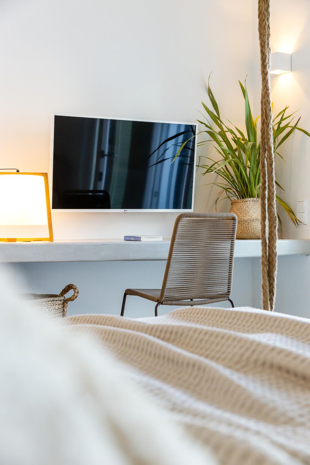 Natural light sweeping across a thoughtfully styled bedroom