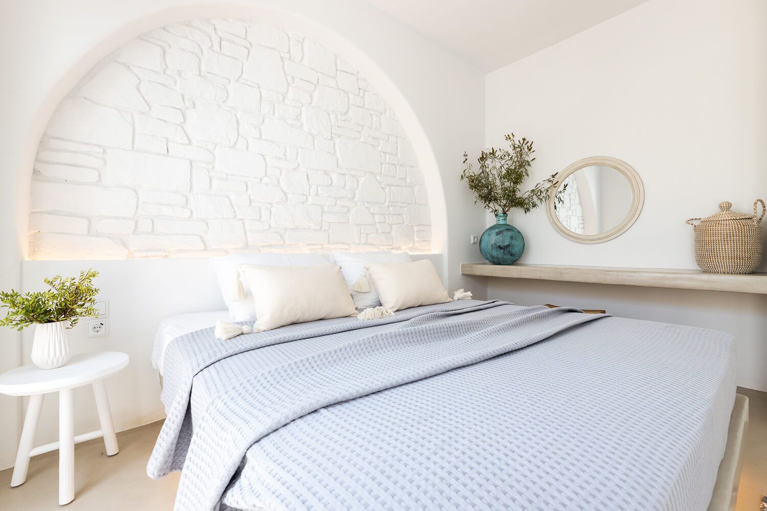 Expertly styled master suite with a calming color palette