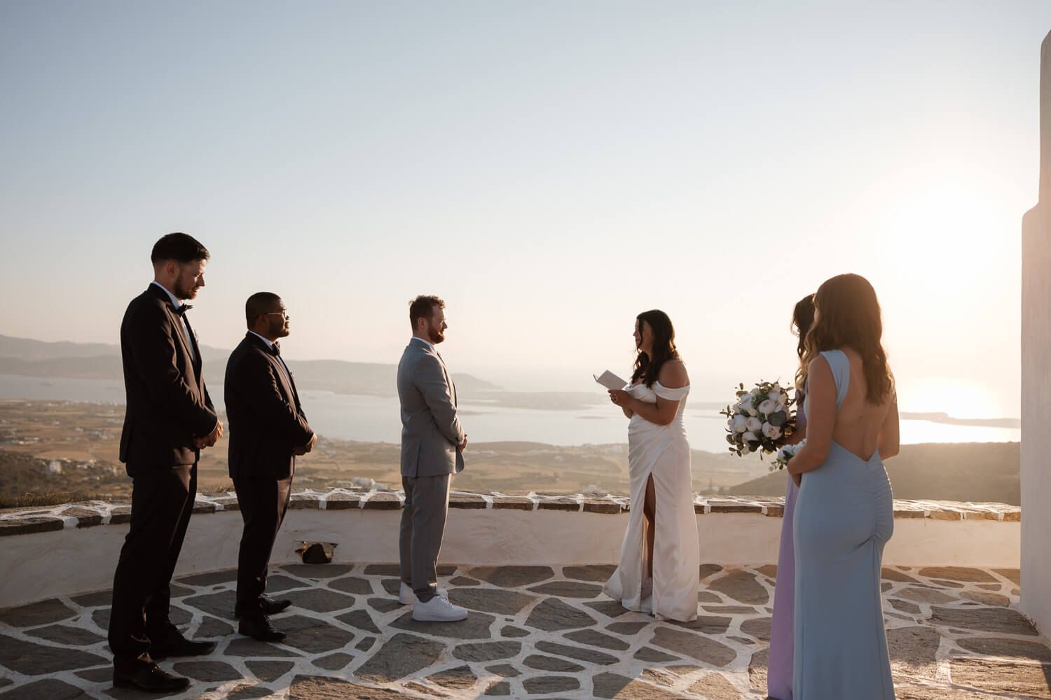 Emotional reading of vows at a private Greek chapel