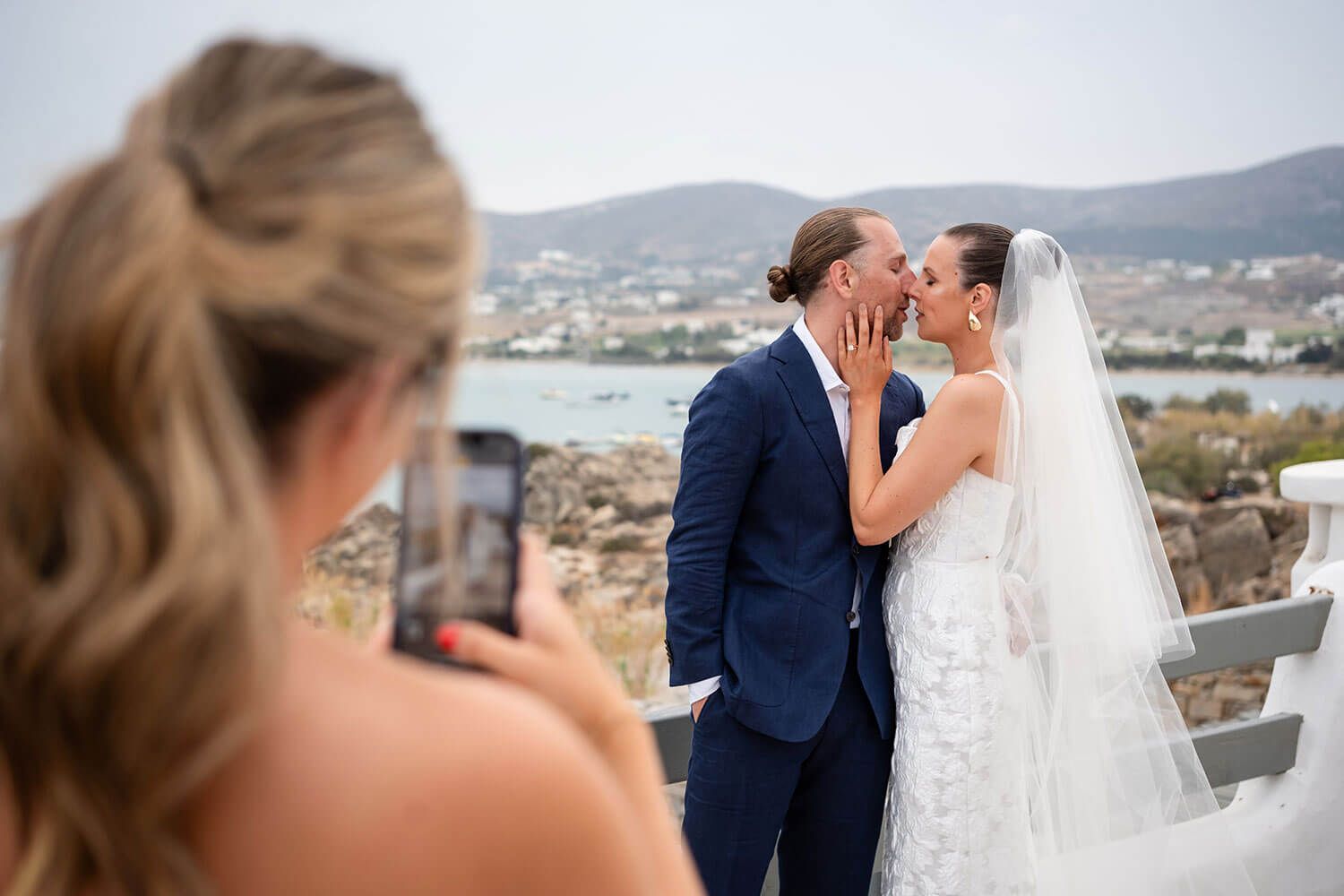 The couple sharing their first kiss as husband and wife in Paros