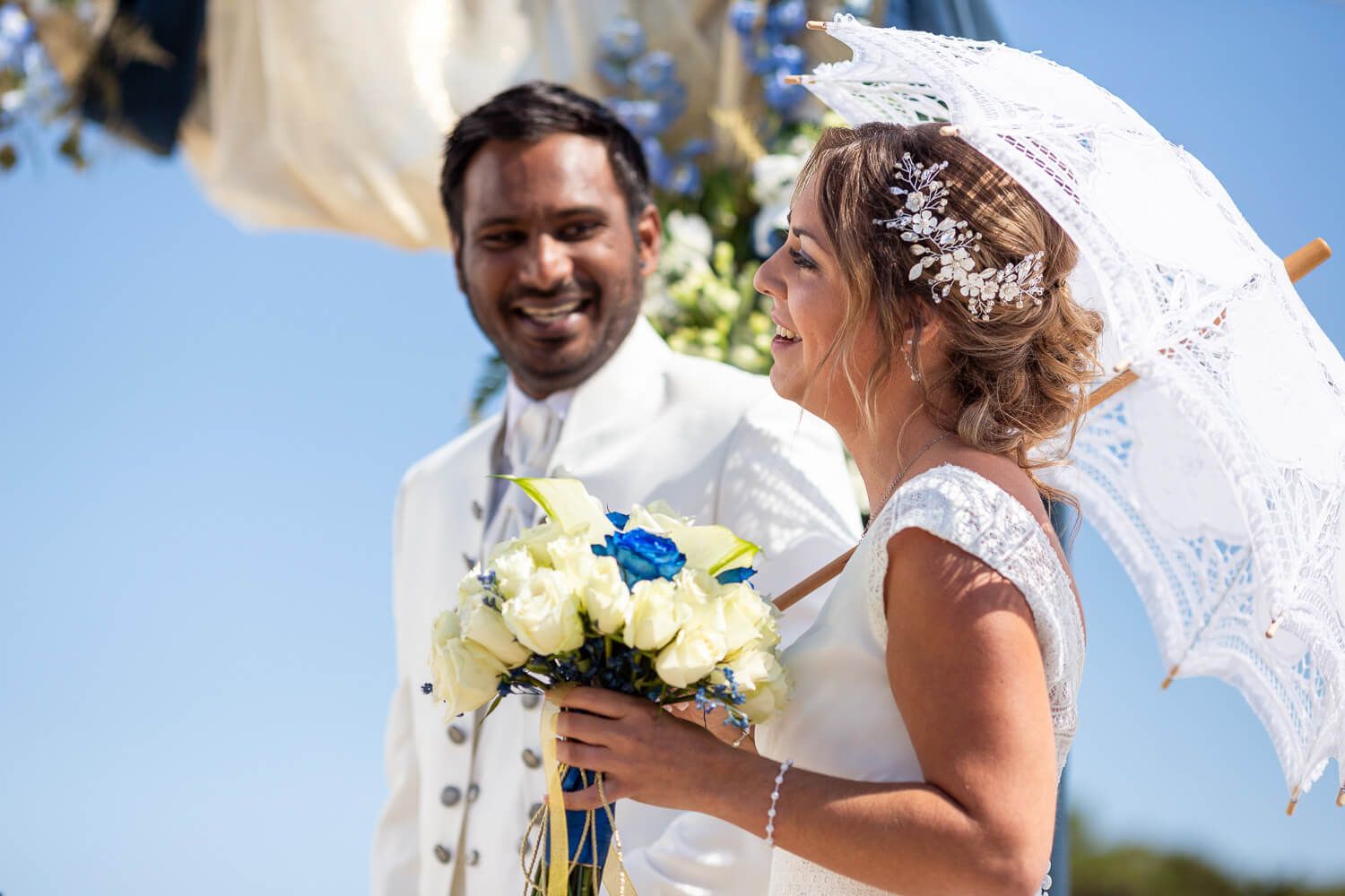 Couple looking at each other during their symbolic wedding ceremony at Pyrgaki Paros