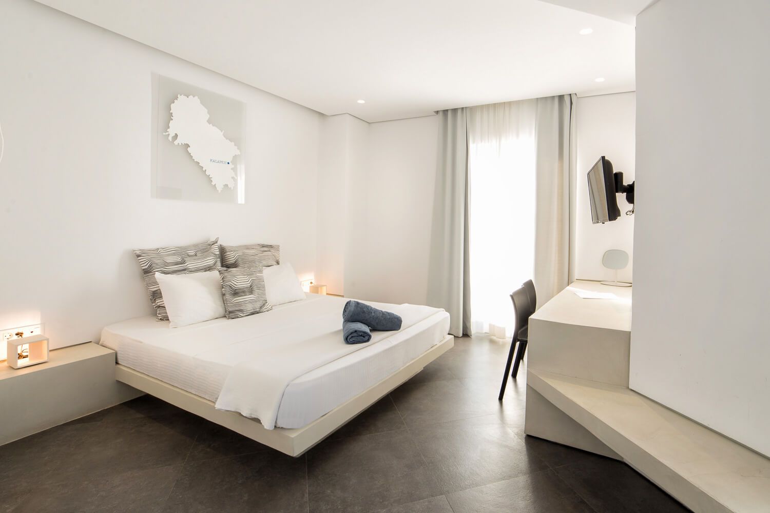 Warm natural lighting enhancing the minimal suite decor