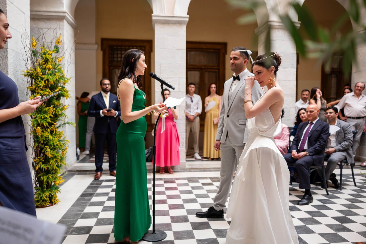 Touching wedding ceremony taking place at a historic town hall