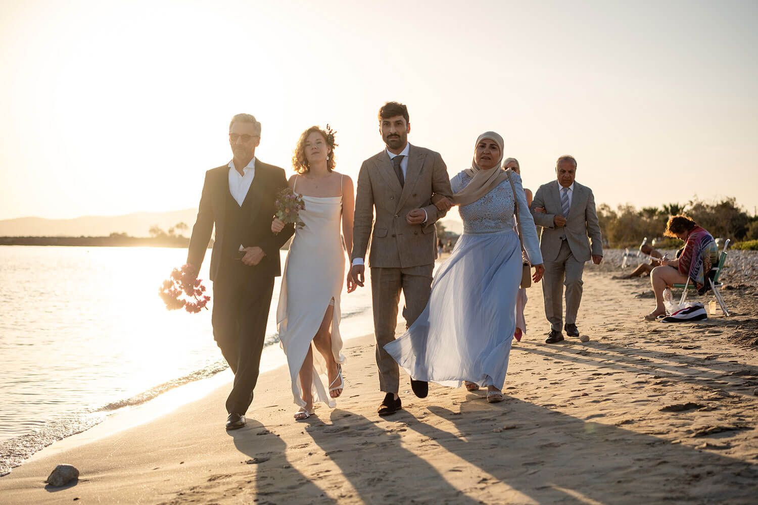Bride Vanessa walking down the sandy aisle for her beachfront wedding