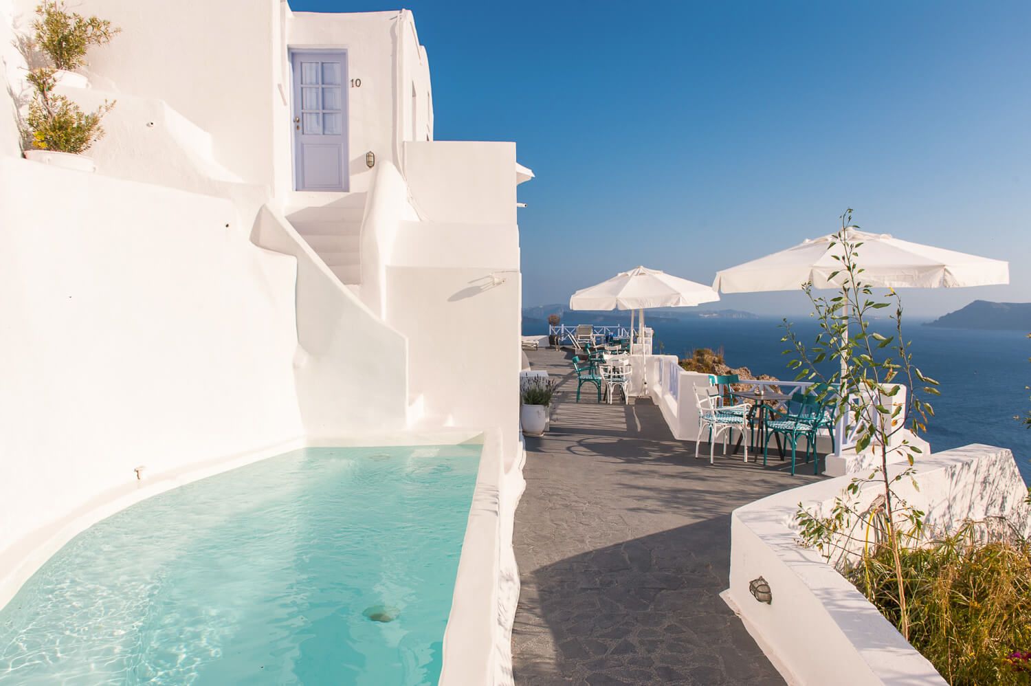 Armeni Village whitewashed exterior facade blending with the rugged landscape