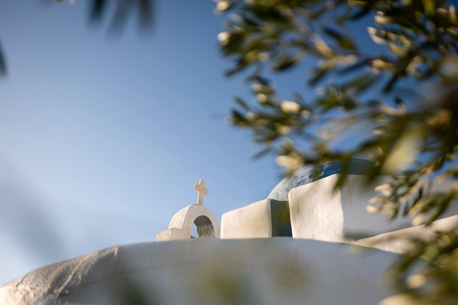 Wide landscape shot of The Secret View venue in Paros under the blue sky
