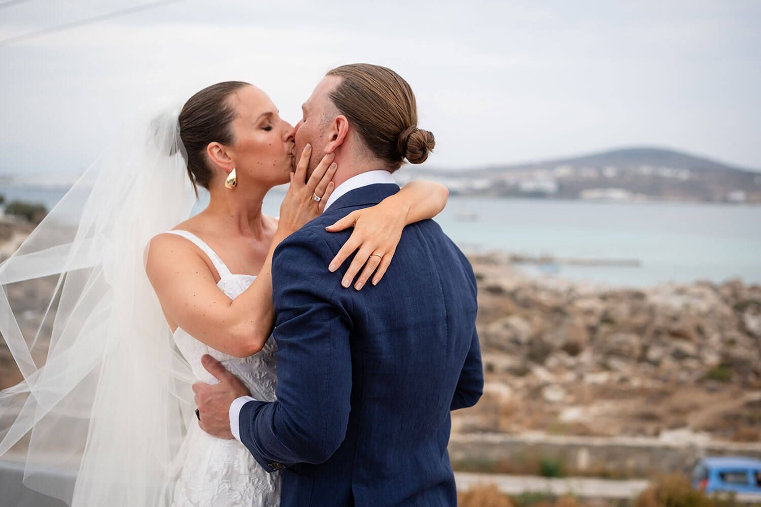 The couple sharing their first kiss as husband and wife in Paros
