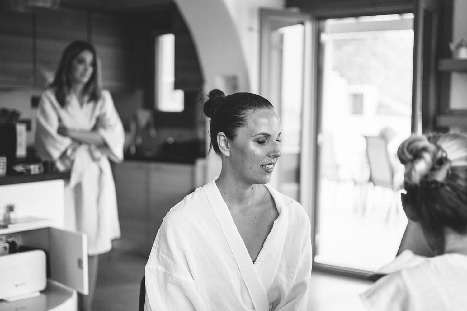 Bride getting her makeup done for her destination wedding in Greece