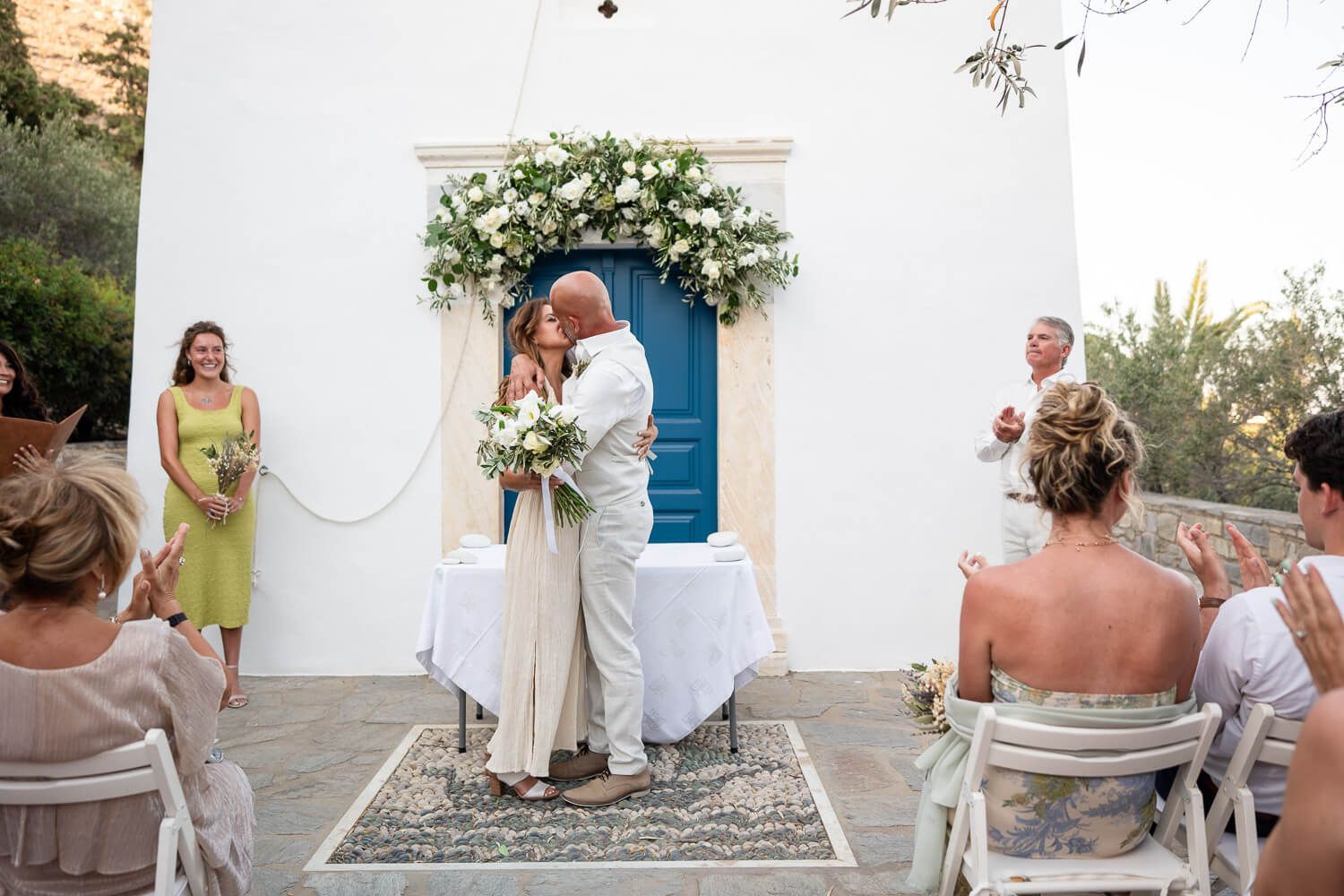 Kathy and Dean sharing their first kiss as a married couple in Paros