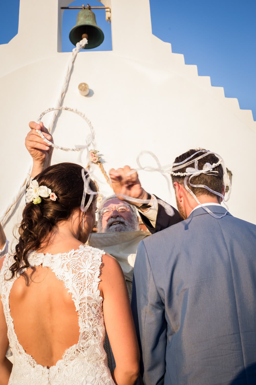 The priest crowning the couple - Traditional Orthodox wedding