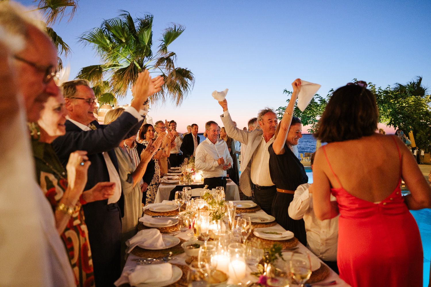 Wedding guests dancing and celebrating in Paros