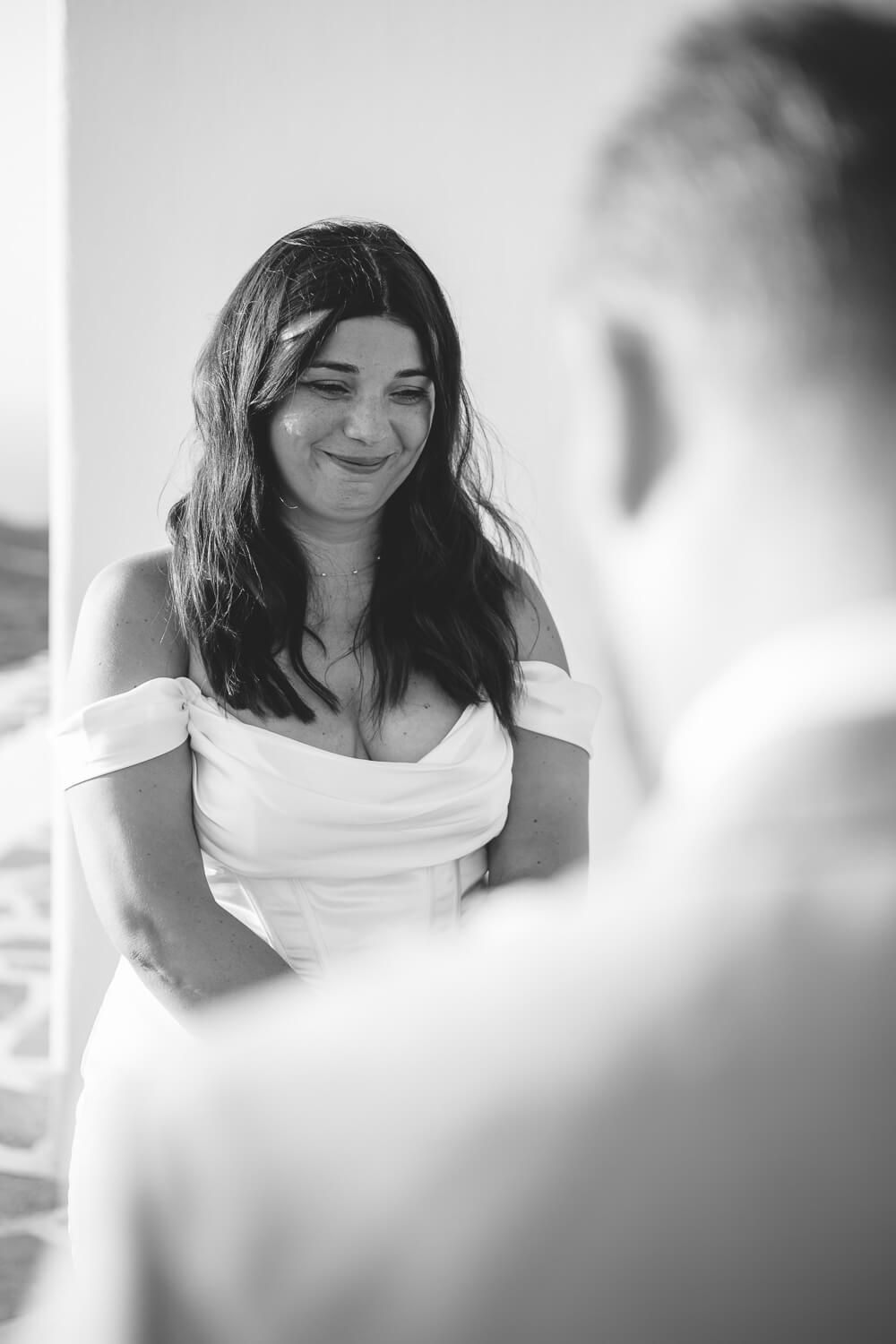 Exchange of wedding rings during hilltop ceremony in Paros