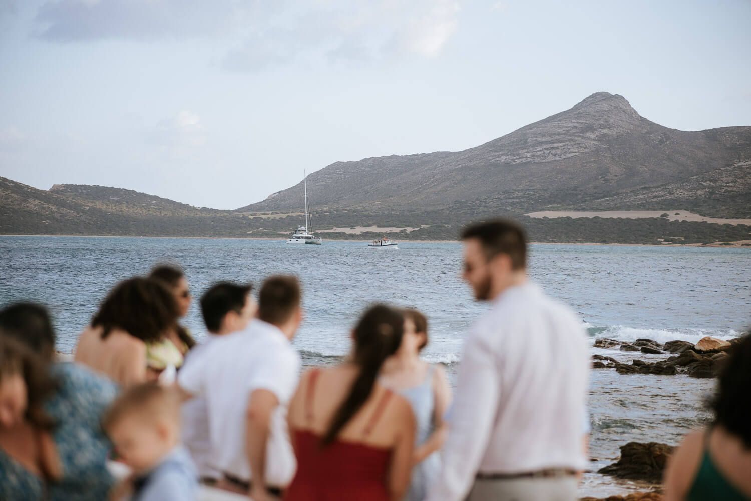 Scenic shot of wedding boat approaching the church