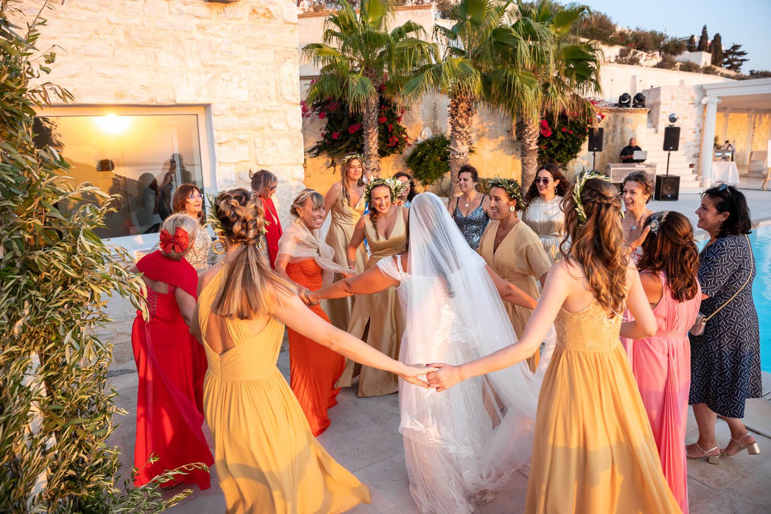 Guests dancing in circles after jewish wedding ceremony in Paros