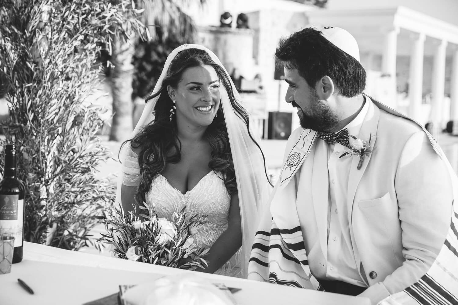 The bride and groom under the Talit during Paros Jewish ceremony