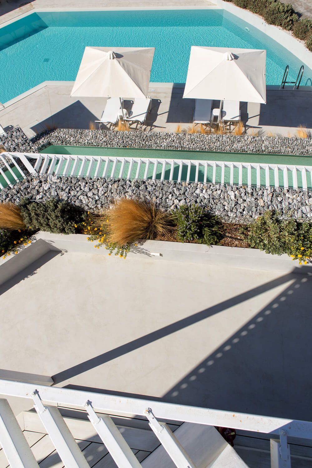 Sun-drenched pool terraces designed for elite hotel guests