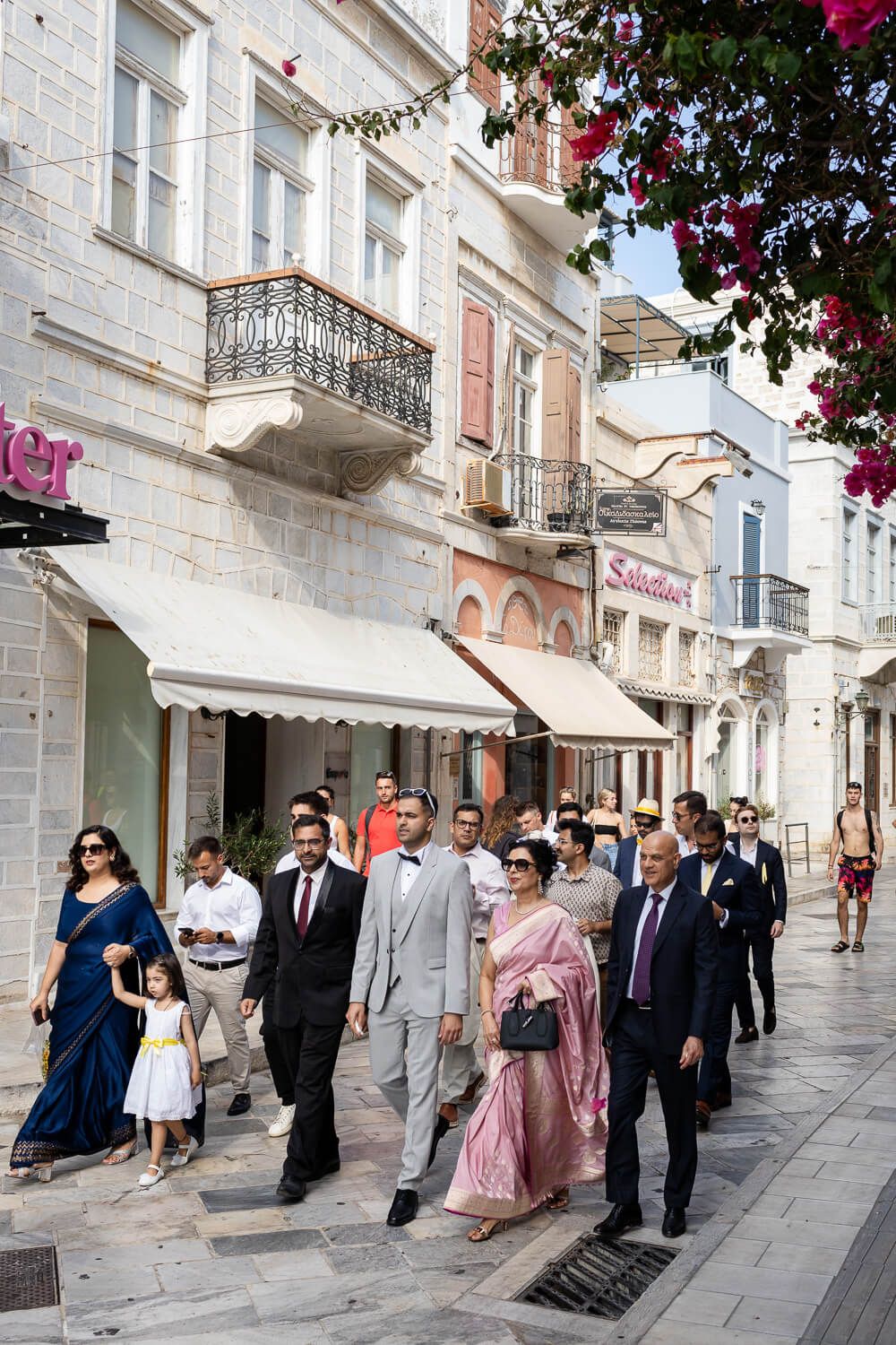 Groom is escorted to the townhall for his wedding ceremony
