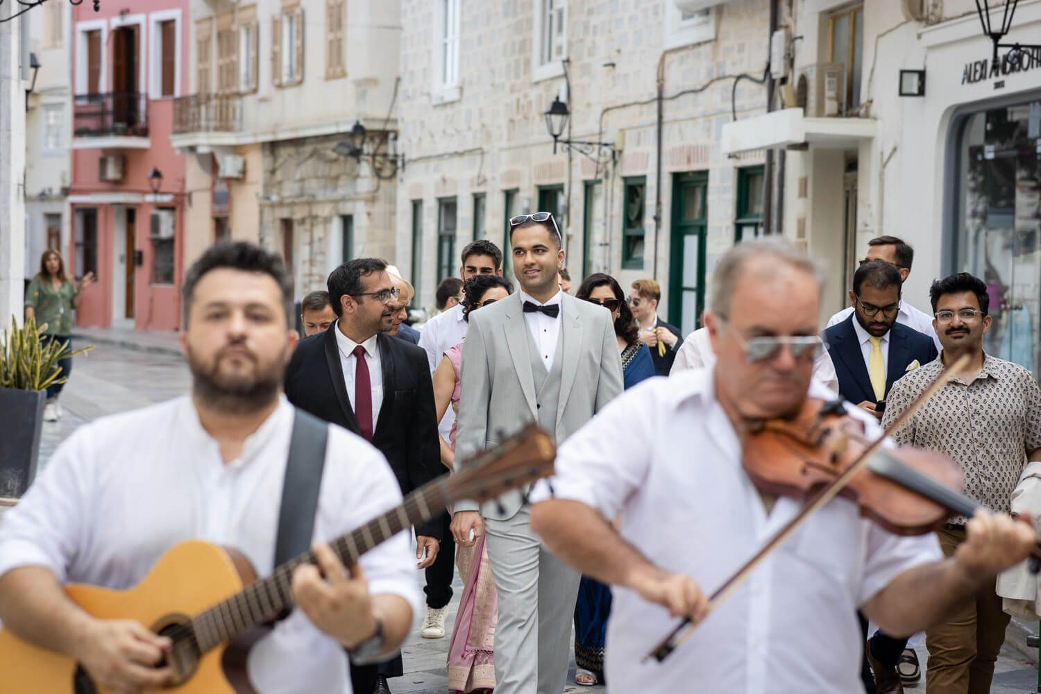 Groom is escorted to the townhall for his wedding ceremony