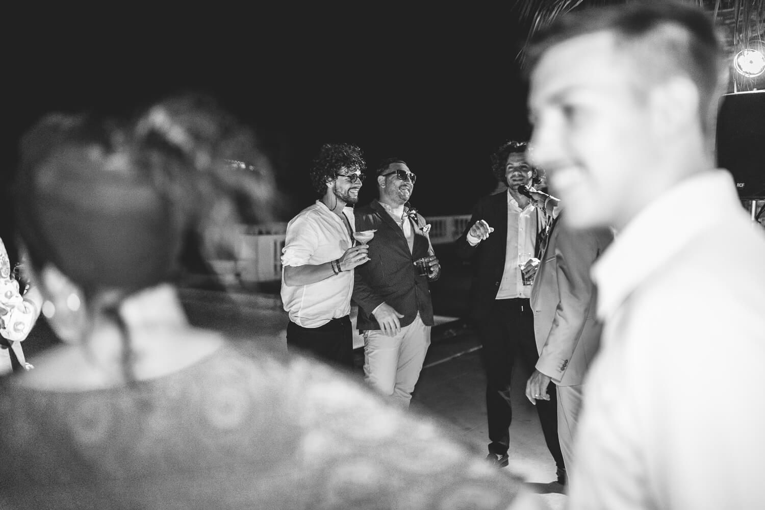 Candid shot of the guests laughing during the wedding speeches