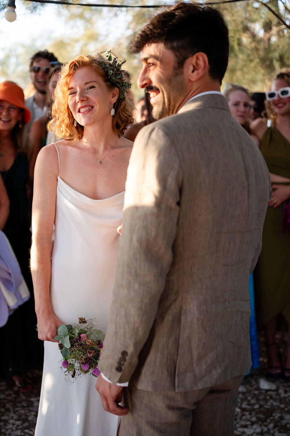 Candid moment of the married couple celebrating by the Aegean Sea