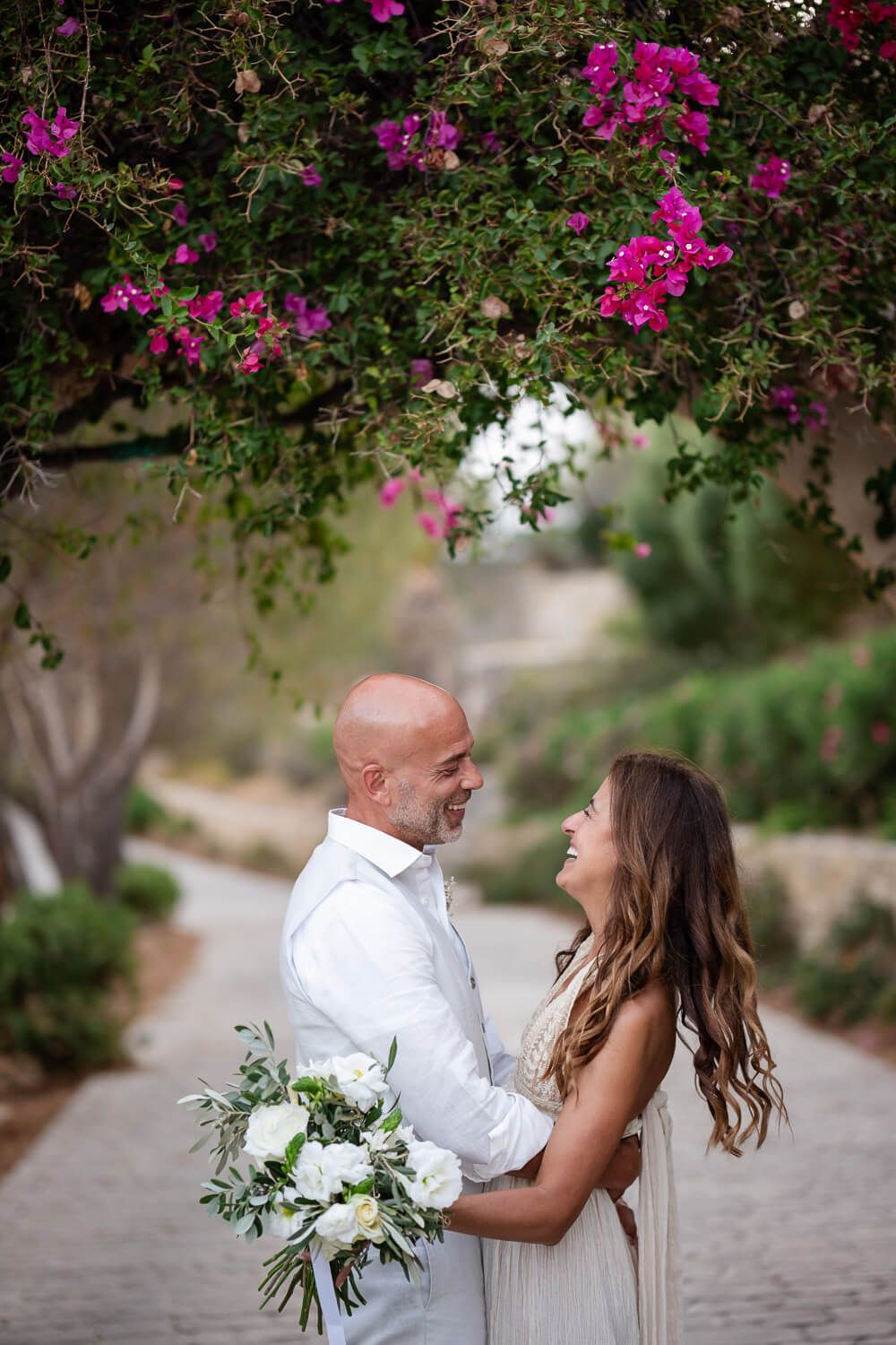 Groom Dean looking lovingly at his bride at Petra Farm Paros