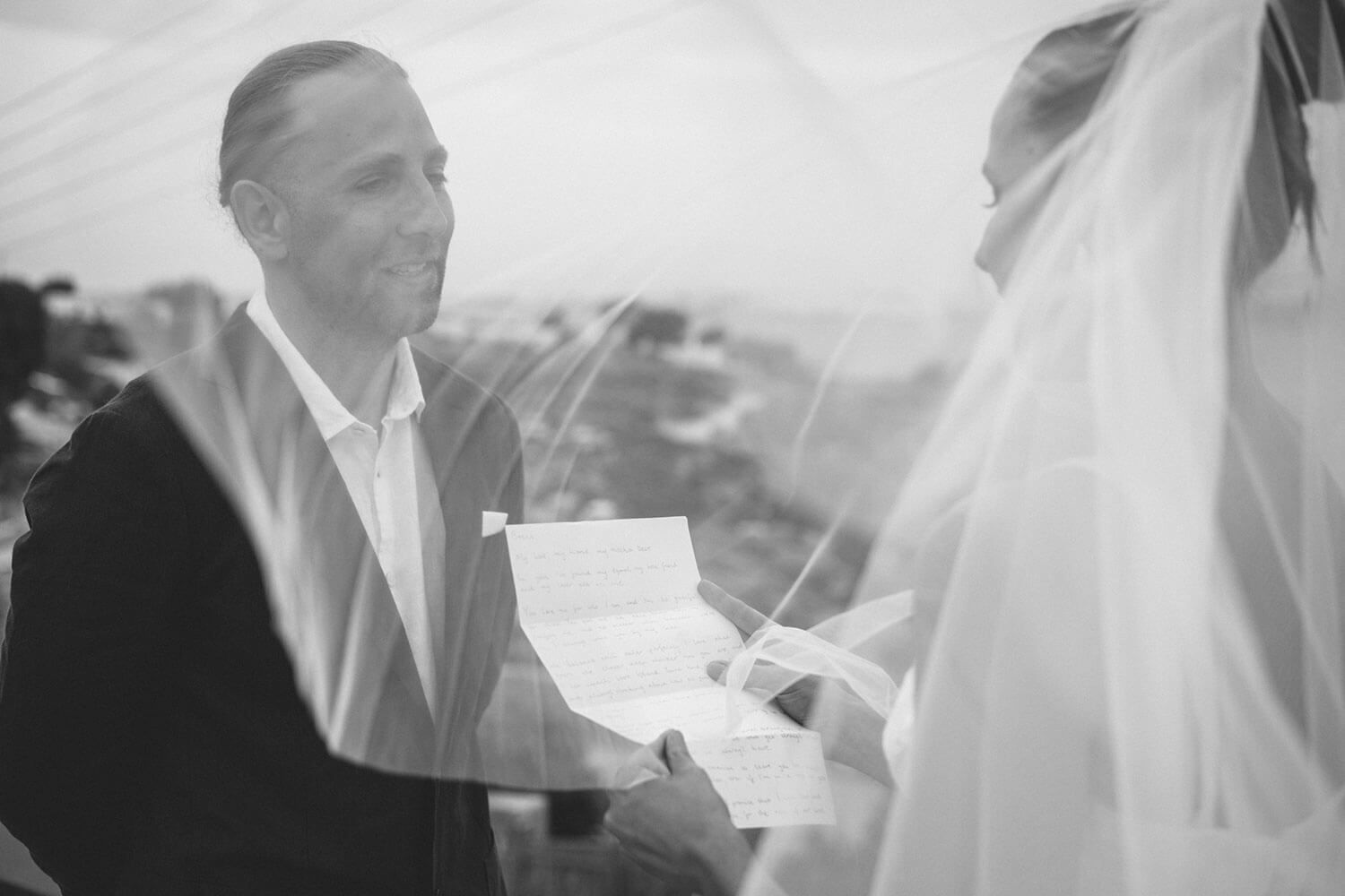 Bride smiling warmly while exchanging vows at her Paros elopement