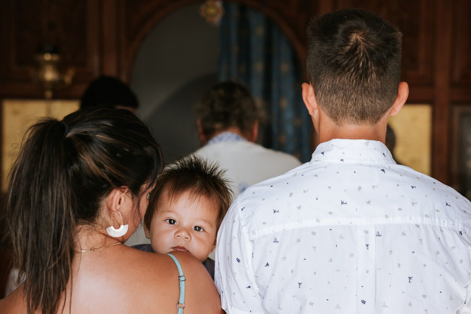 Intimate family baptism at Agios Georgios Antiparos