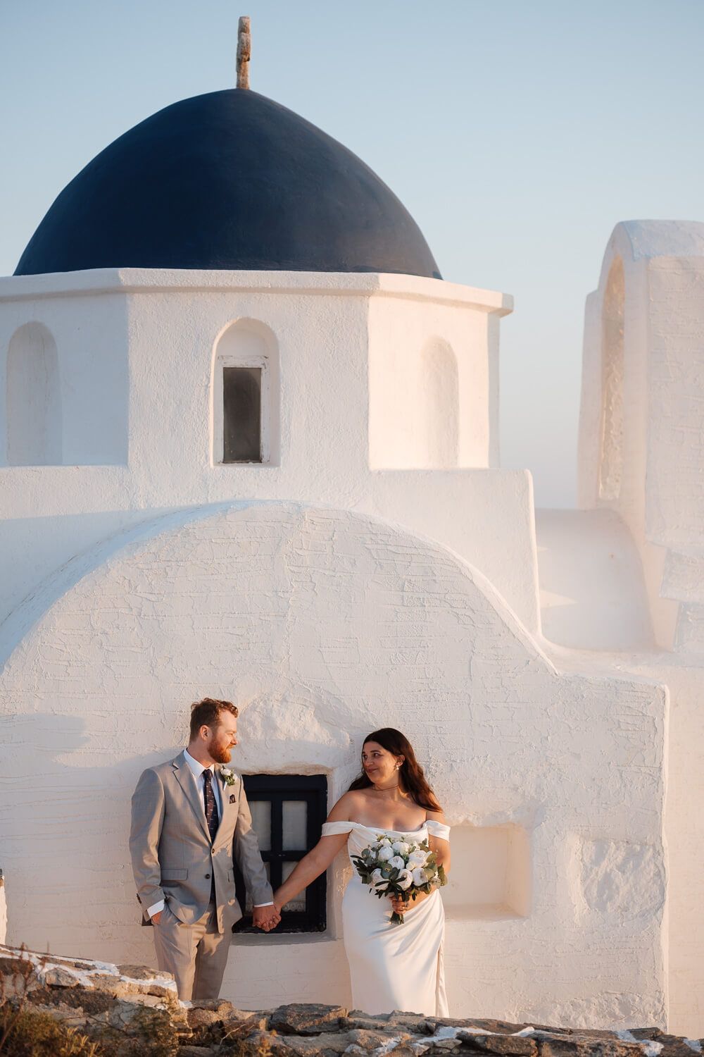 Intimate Paros elopement photography with a romantic couple exchanging vows overlooking the Aegean.