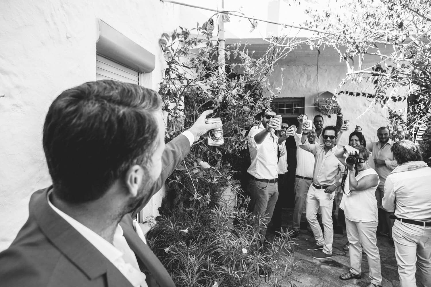 Traditional Greek groom preparation with family and friends