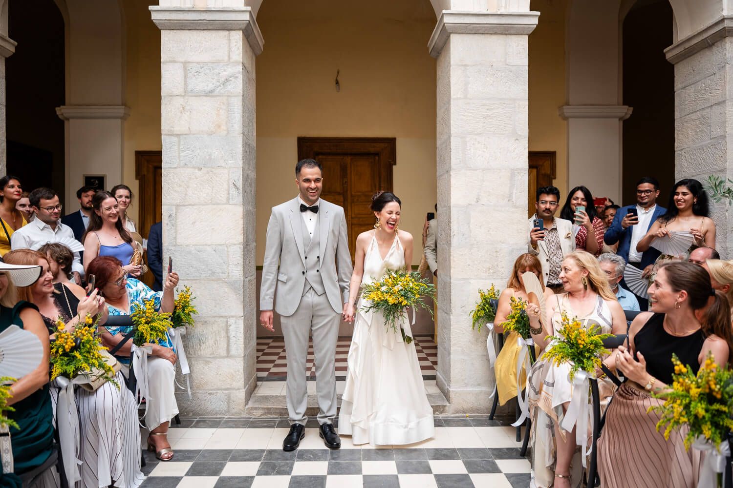 Couple making a grand entrance at their wedding ceremony in Syros Greece