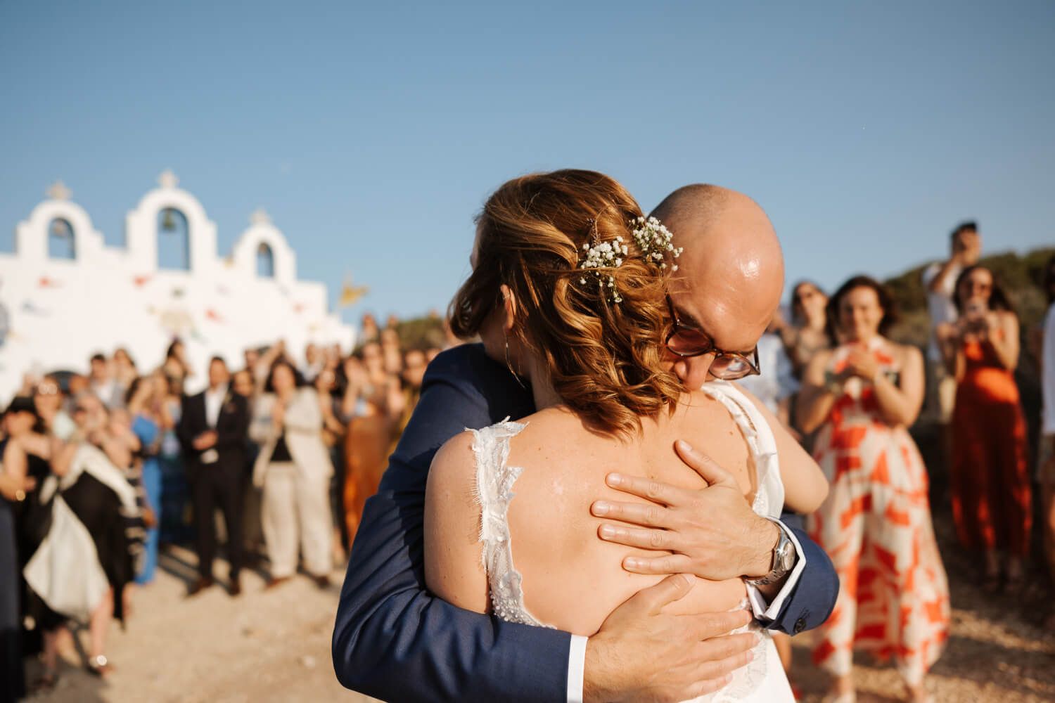 Dimitris handing Ioanna her bridal bouquet at Pyrgaki Paros
