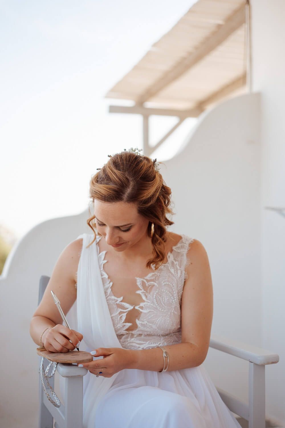 Ioanna putting on her wedding shoes before the Pyrgaki ceremony
