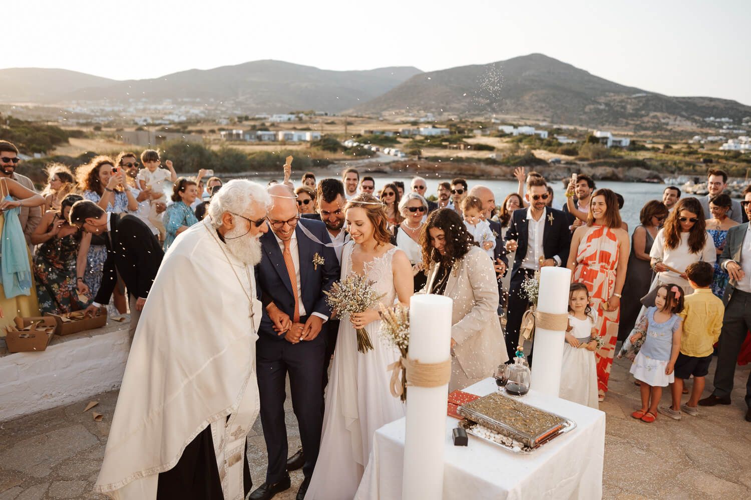 The couple taking their first steps around the altar in Greece