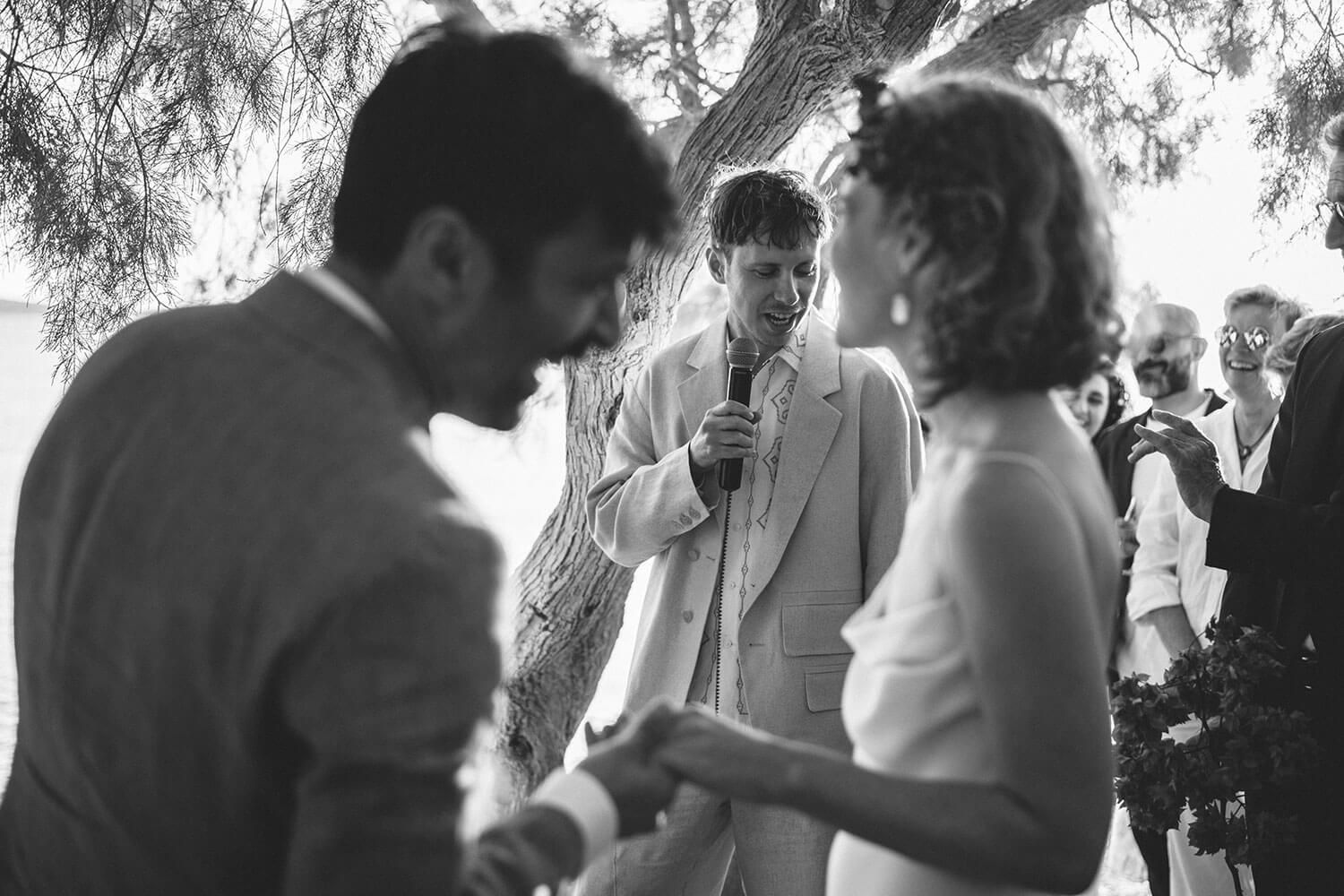 Authentic Greek island wedding ceremony with toes in the sand