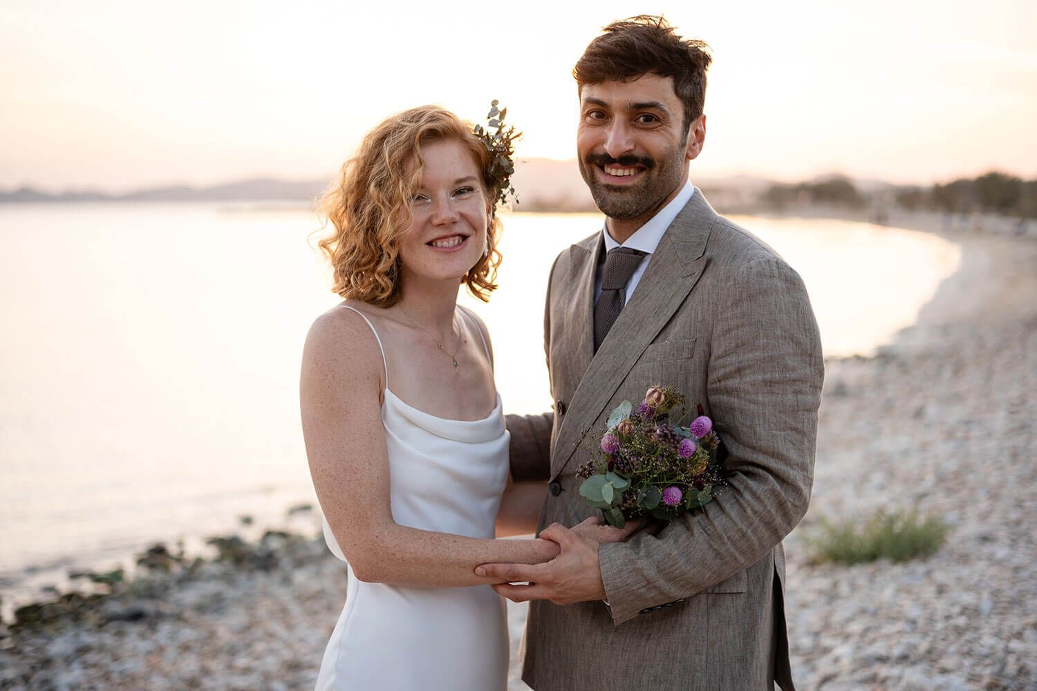 Romantic golden hour couple portraits on the beach in Aliki Paros