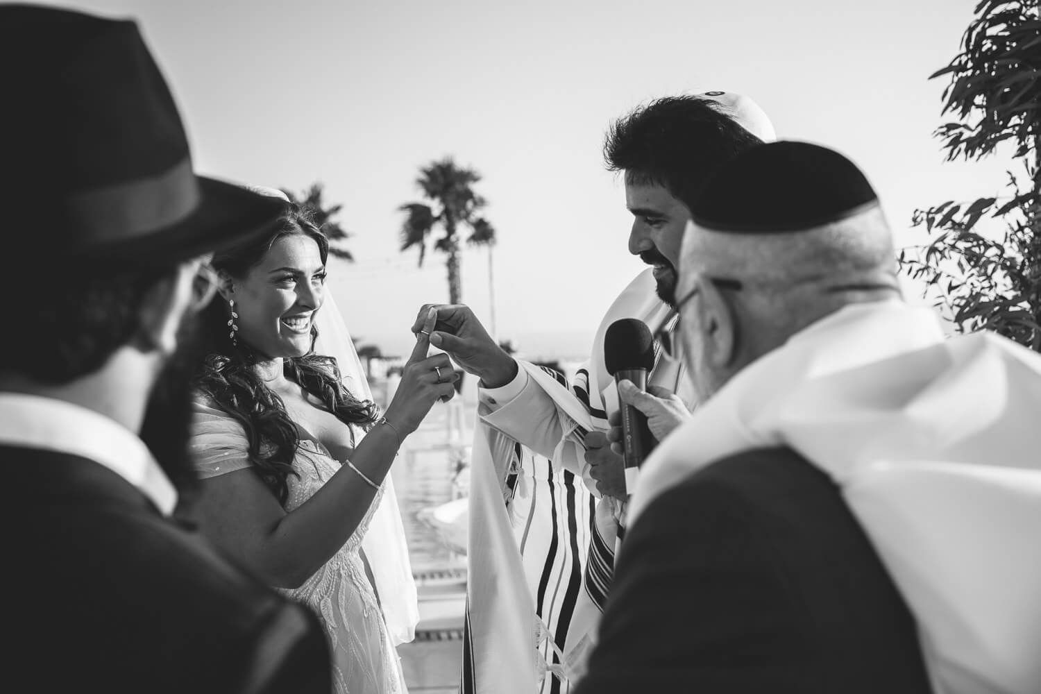Exchange of rings during a traditional Jewish wedding in Paros