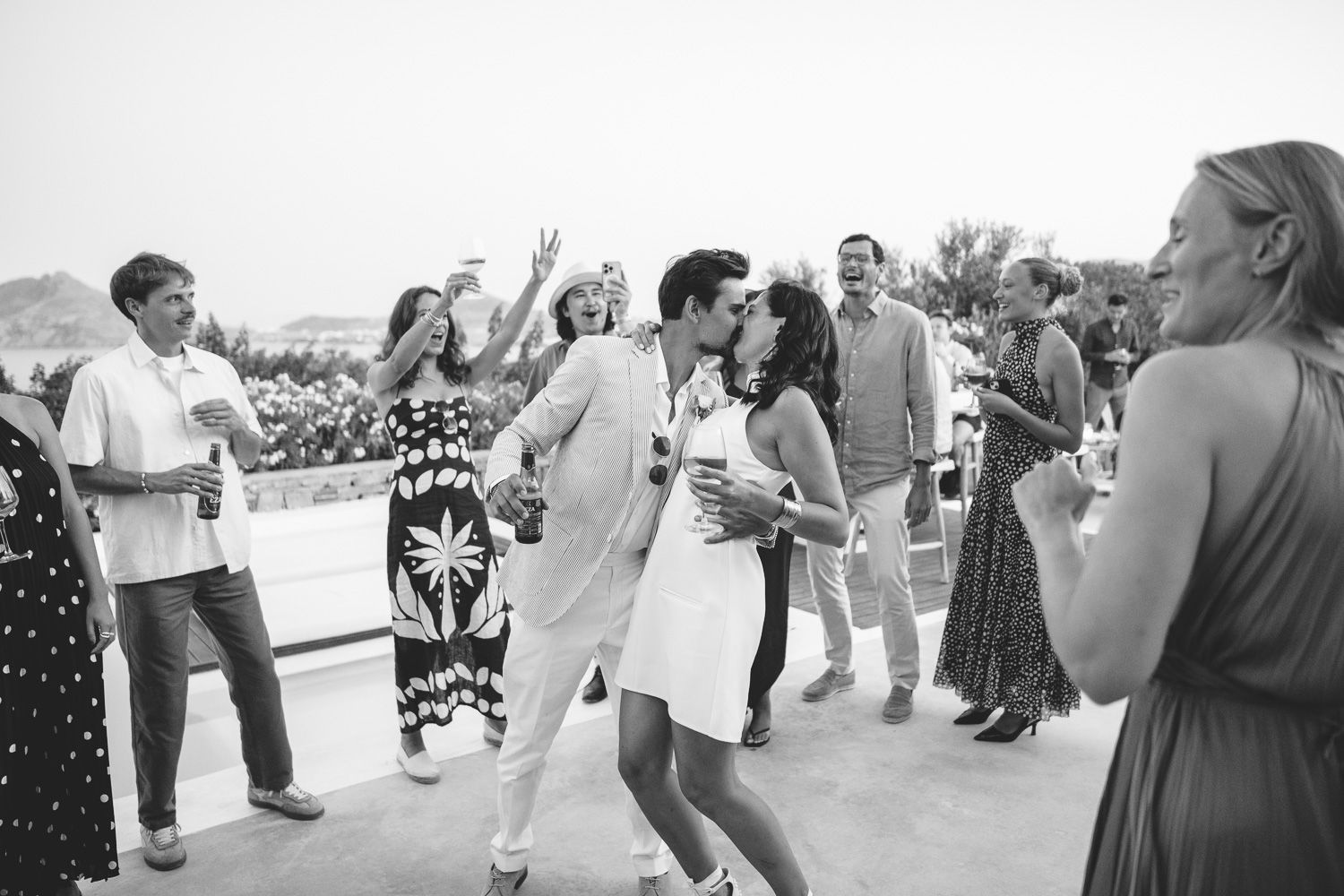 Couple kissing at a wedding party in Paros Greece