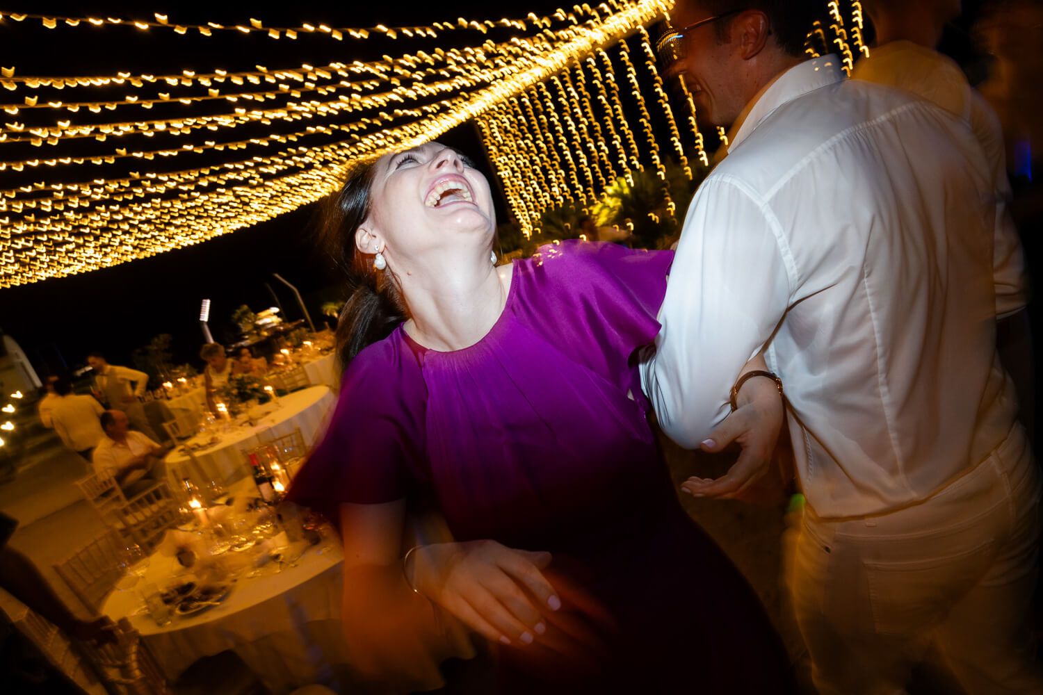 Epic nighttime wedding photography of a crazy party in the Cyclades