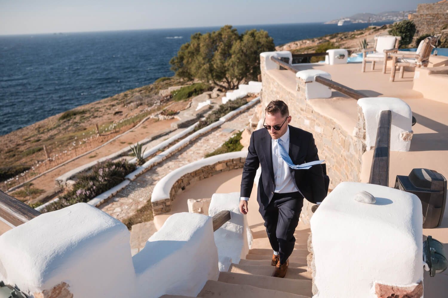 Groom Cody getting ready before his private villa wedding in Paros