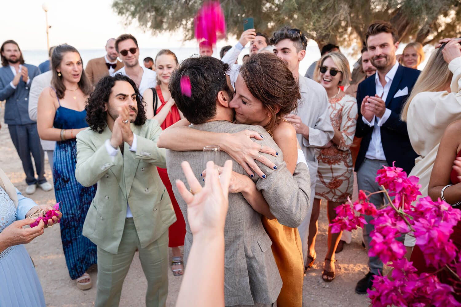 Guests greeting the groom during a wedding reception in Paros Greece.