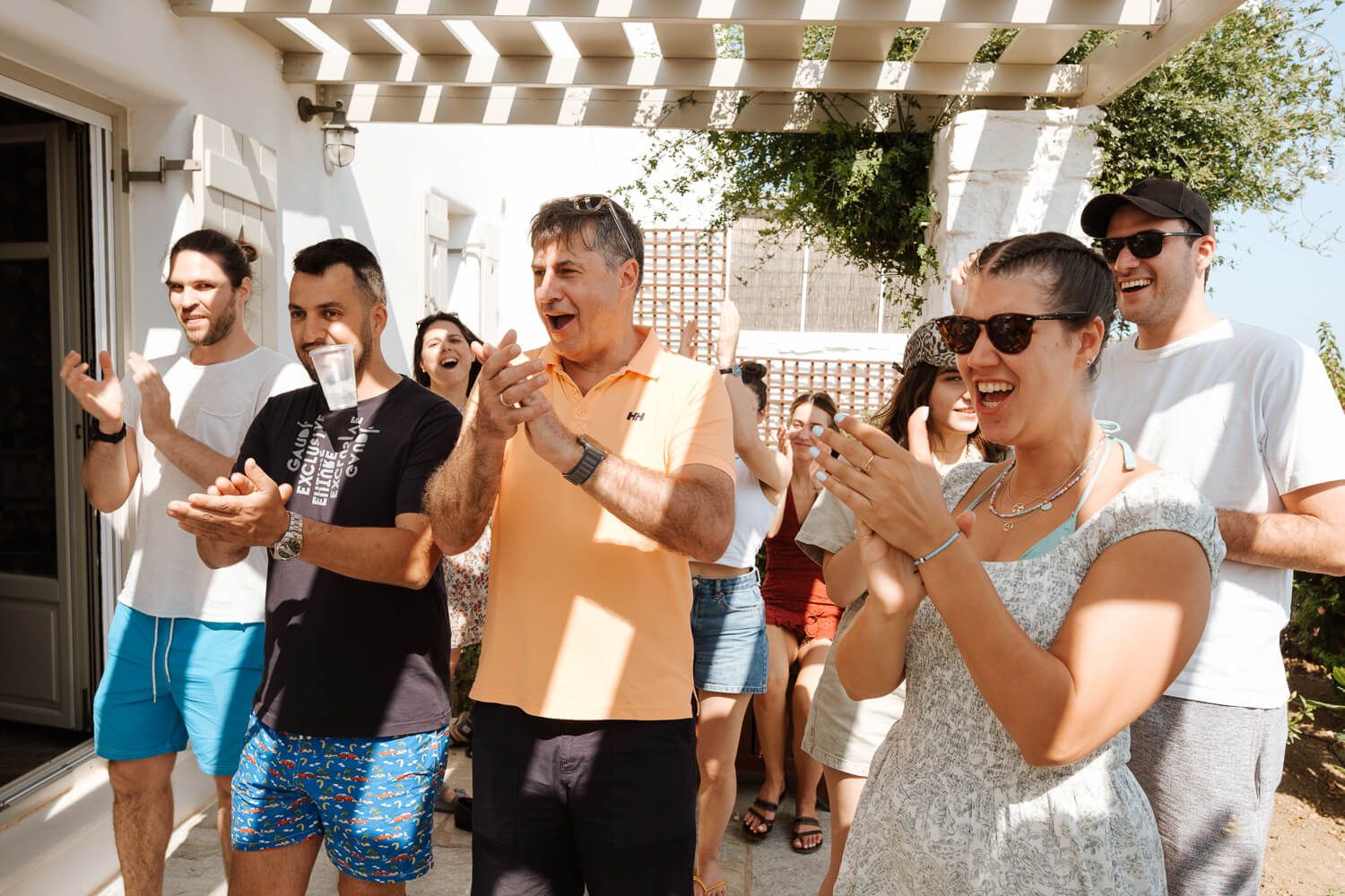 Candid moments of the groom's family in Golden Beach Paros