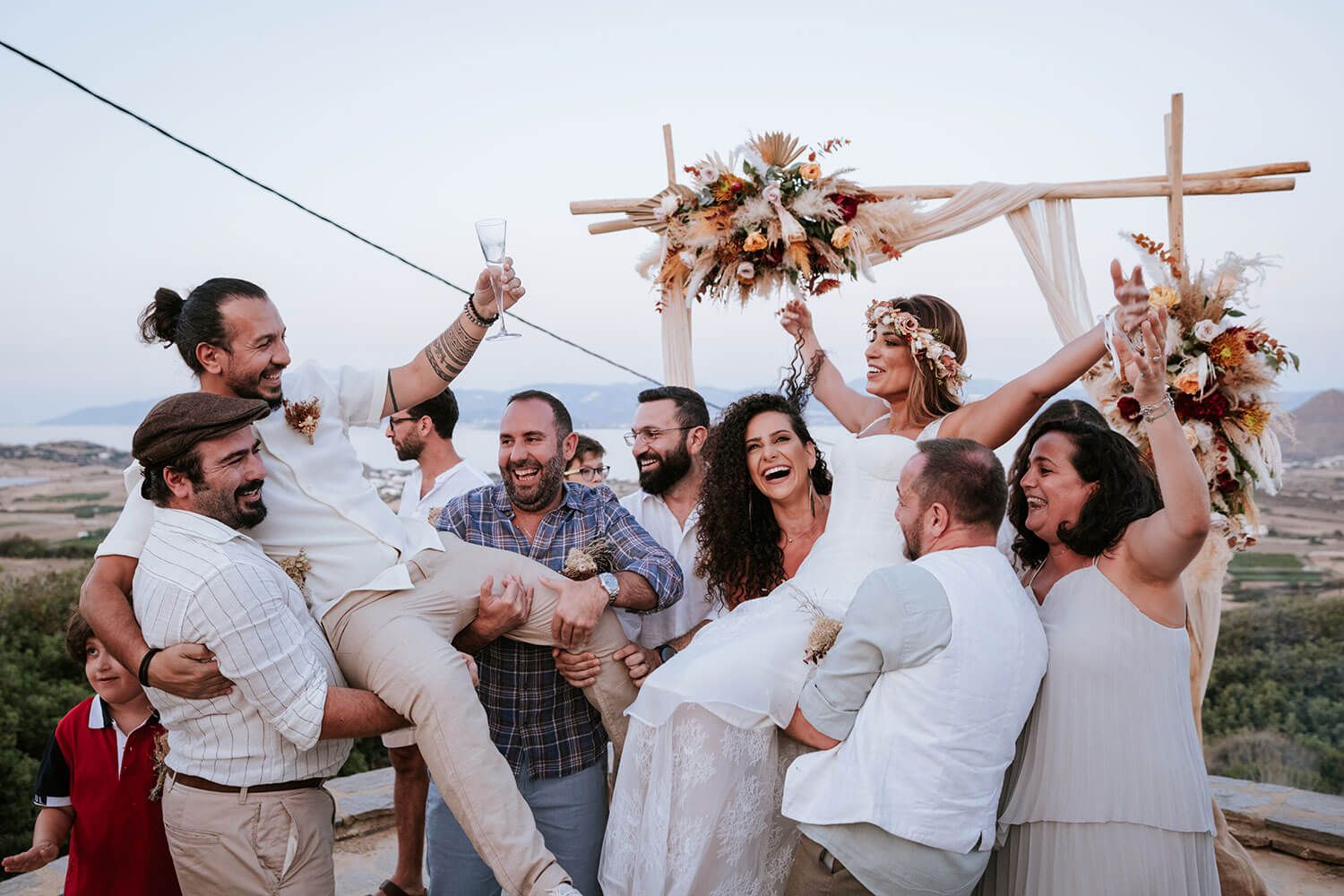 Guests throwing petals at the happy newlyweds in Isterni Paros