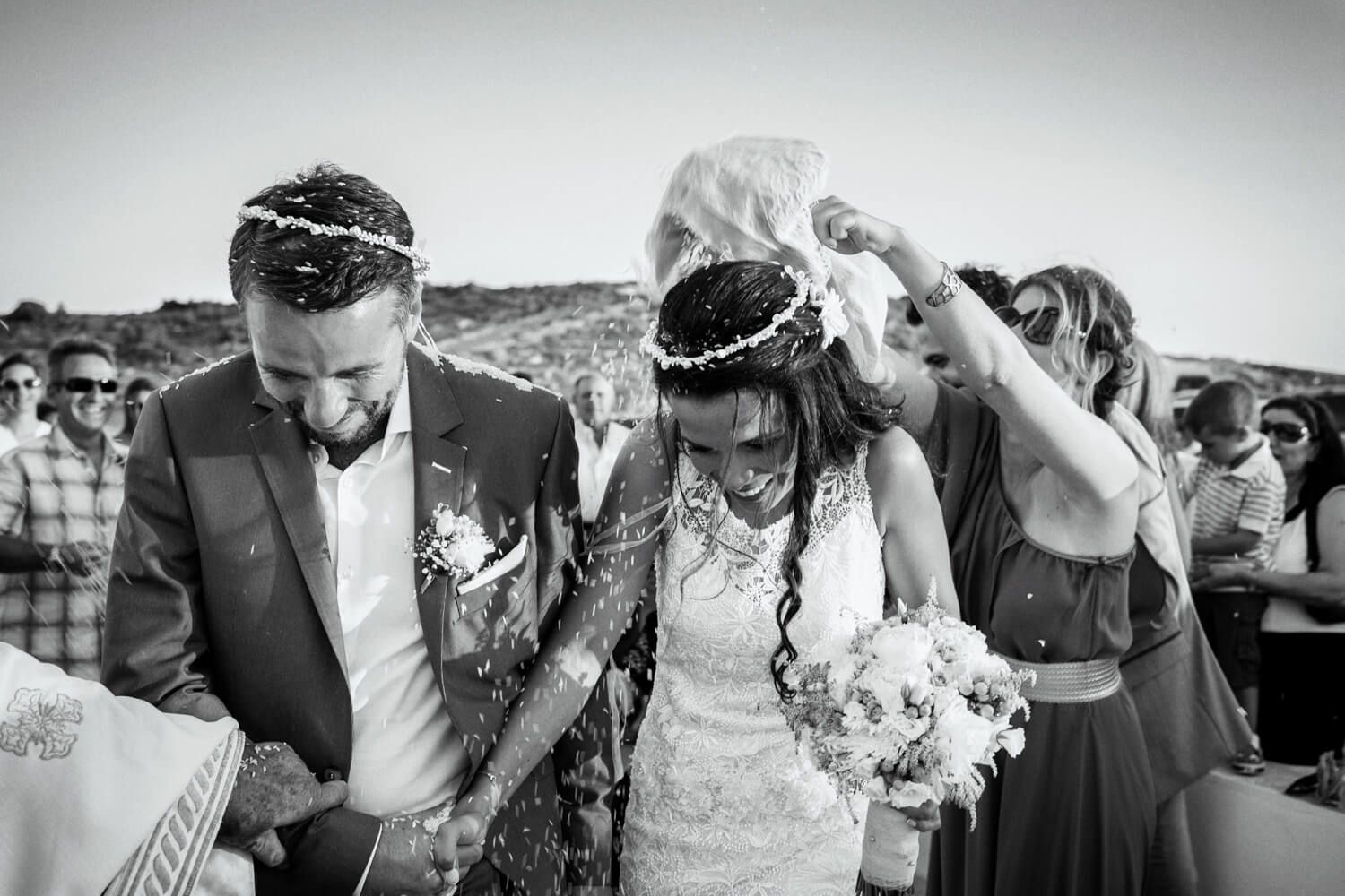 Guests throwing rice at the newlyweds - Greek wedding tradition