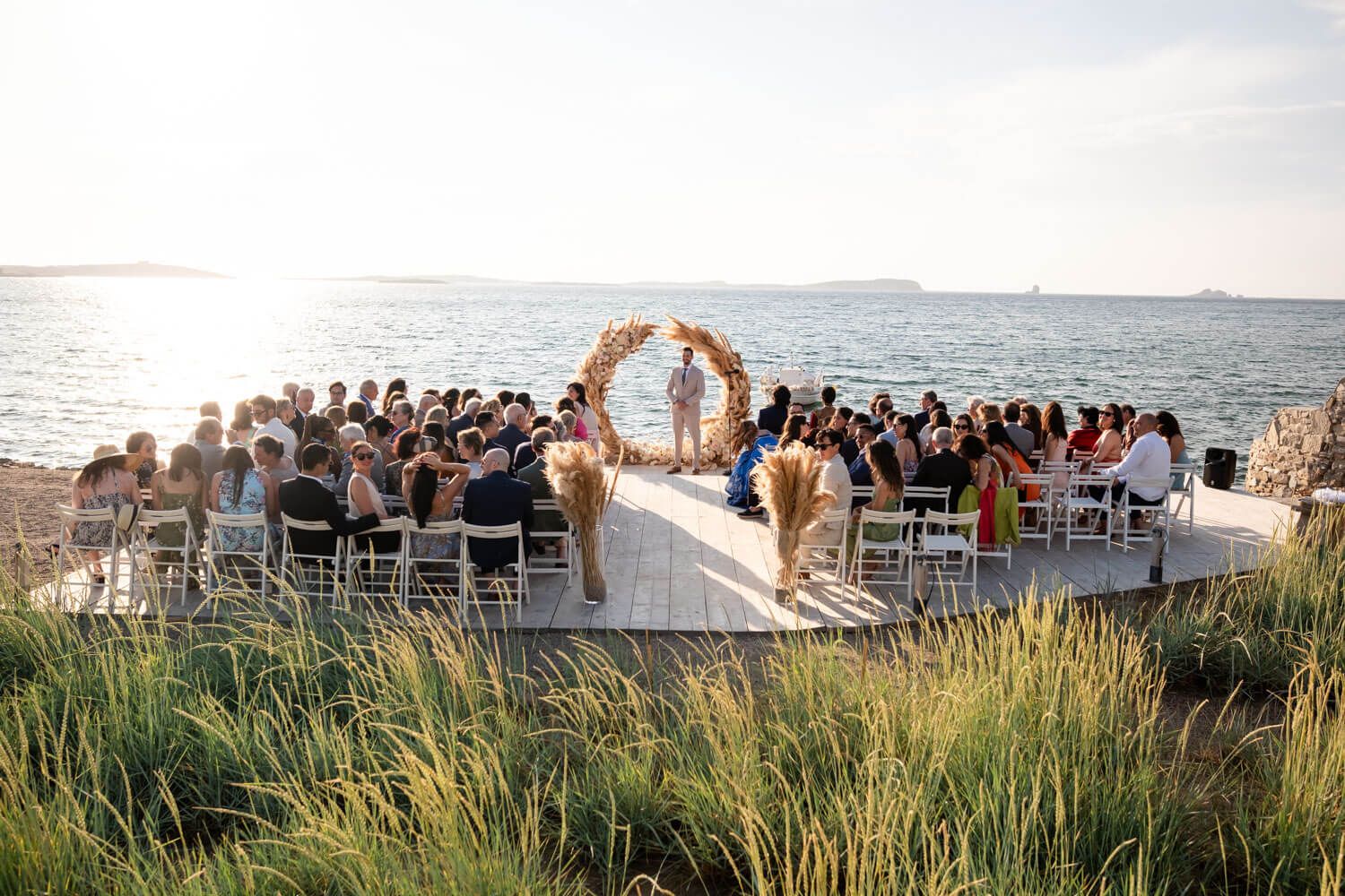 Wide shot of the wedding ceremony setup at Seesoo beachside venue