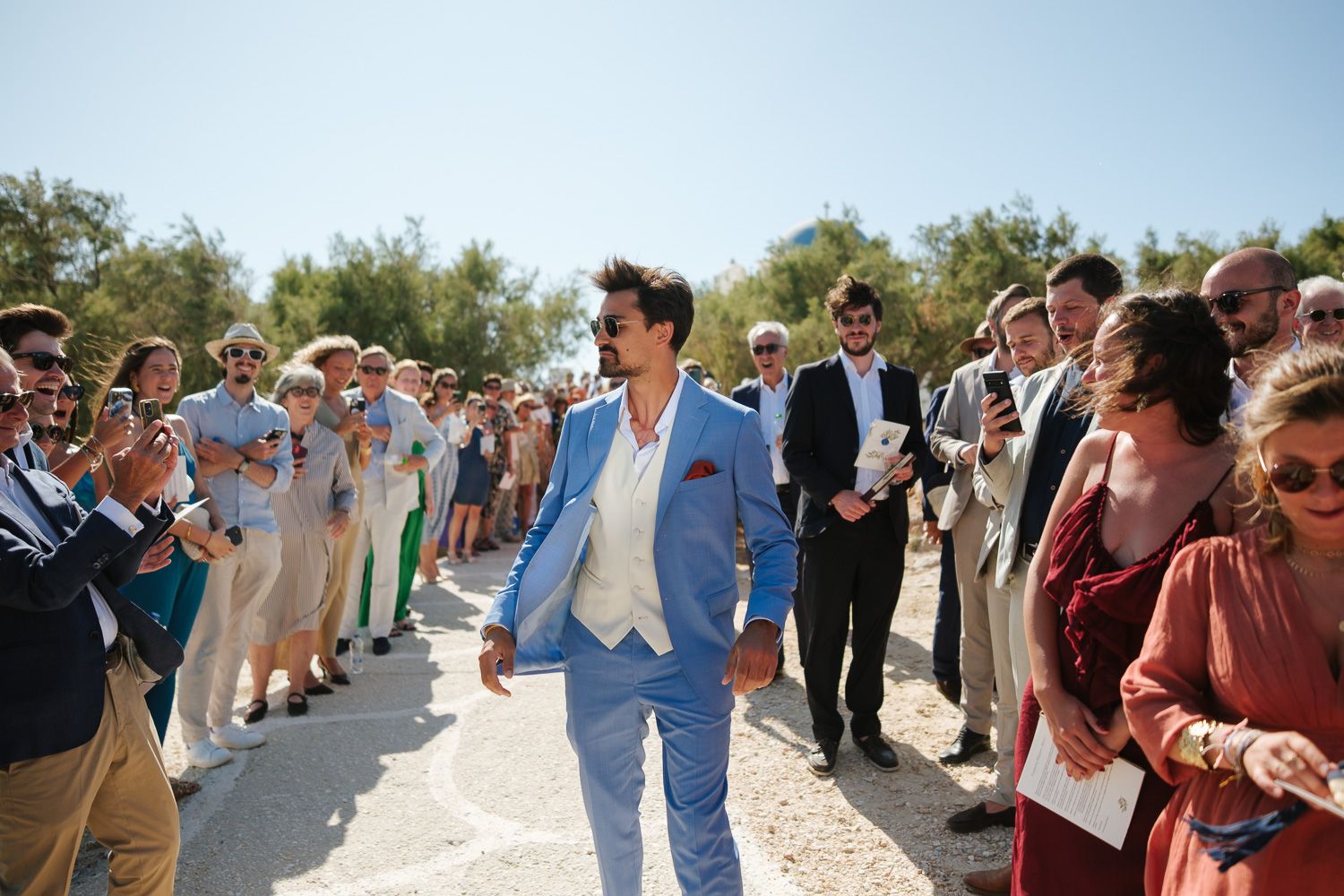 Bride arriving by boat at Agios Fokas chapel Paros