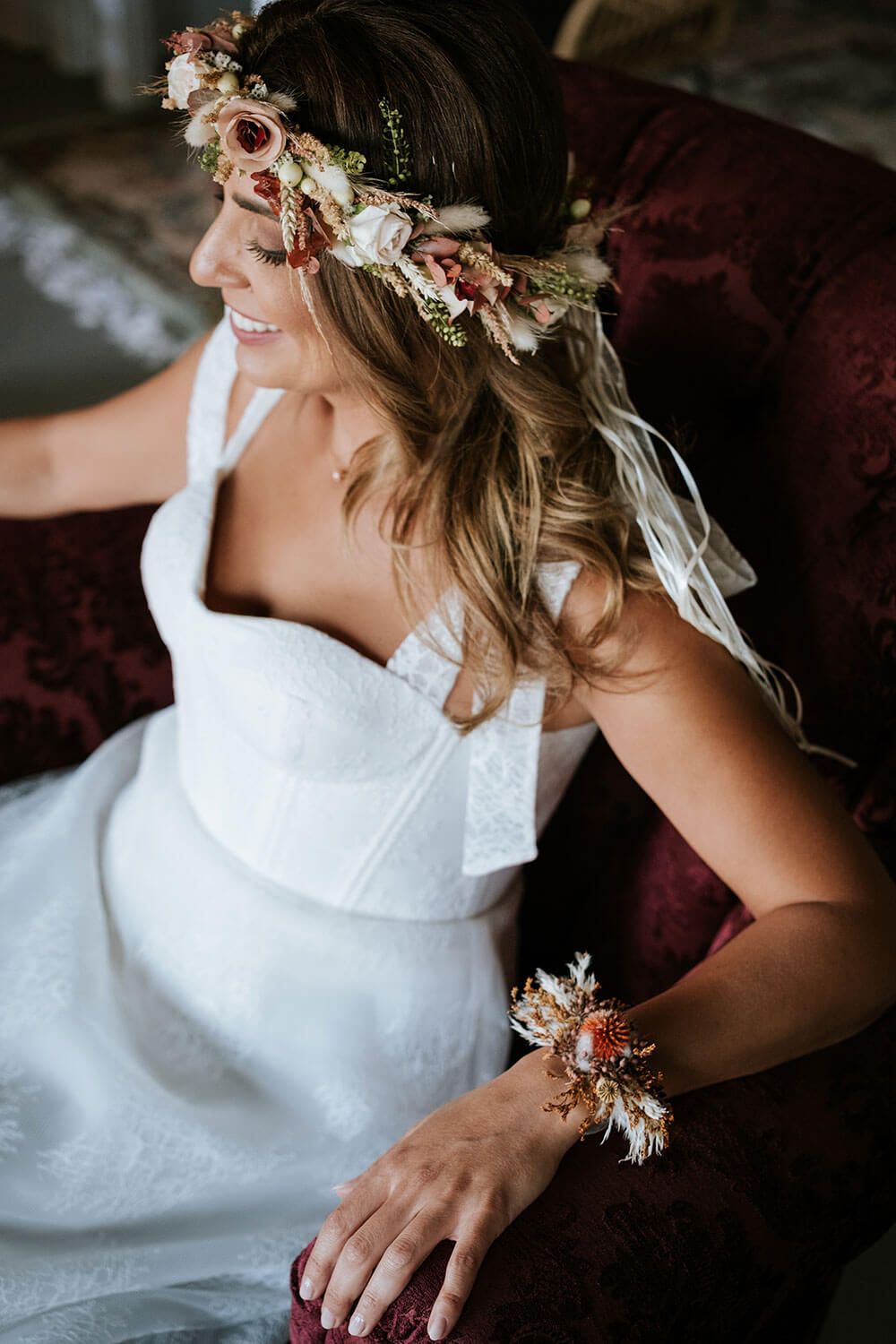 A bride wearing a white dress and floral crown sits in moody lighting, captured in a series of close-up detail shots.