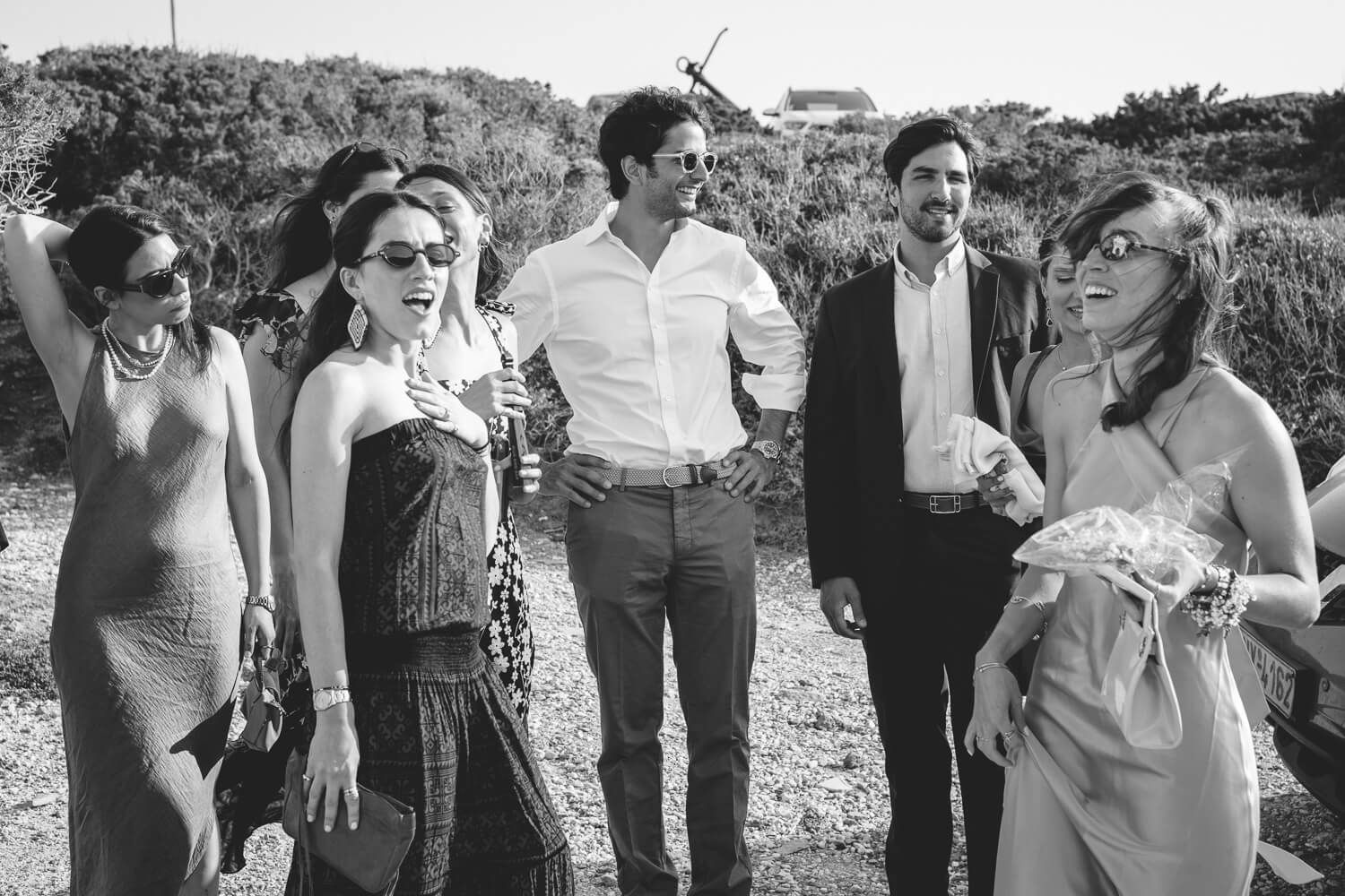 Guests chatting and laughing before a wedding in Paros
