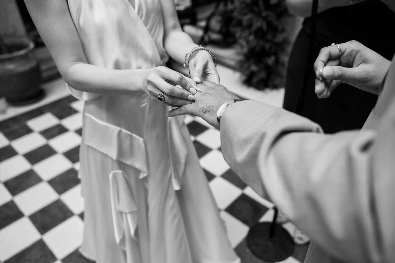 Couple exchanging rings during their wedding ceremony in Ermoupolis